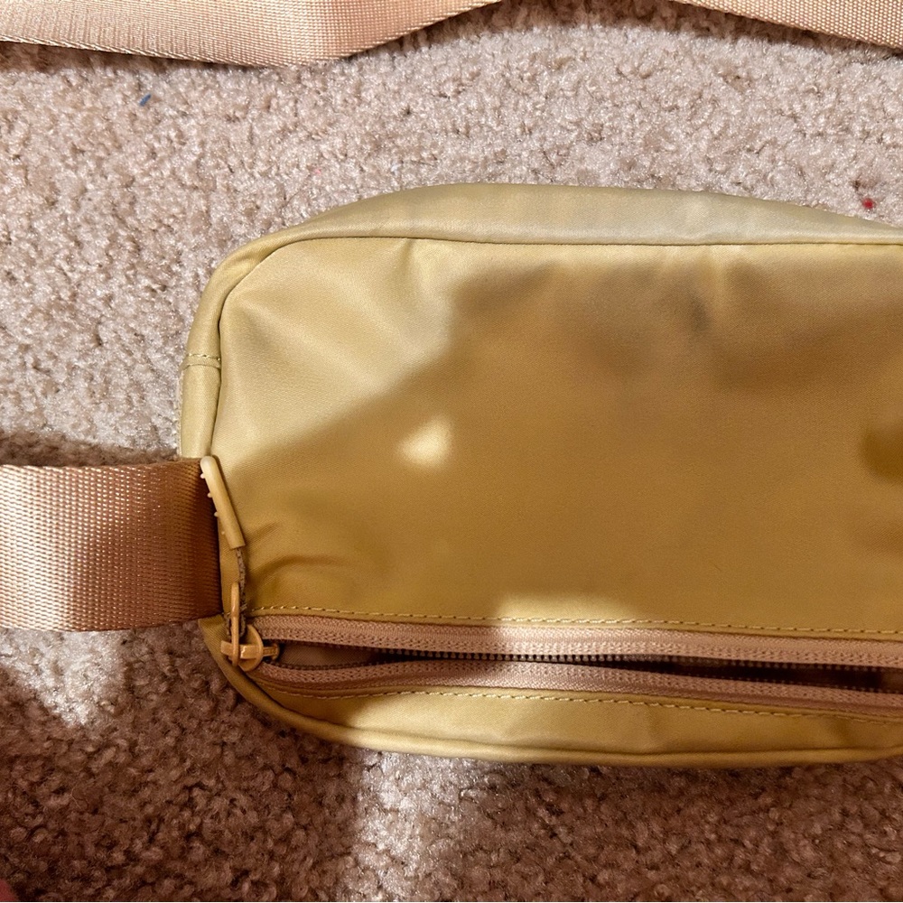 Tan (looks yellow) lululemon bag a little dirty but easily washable